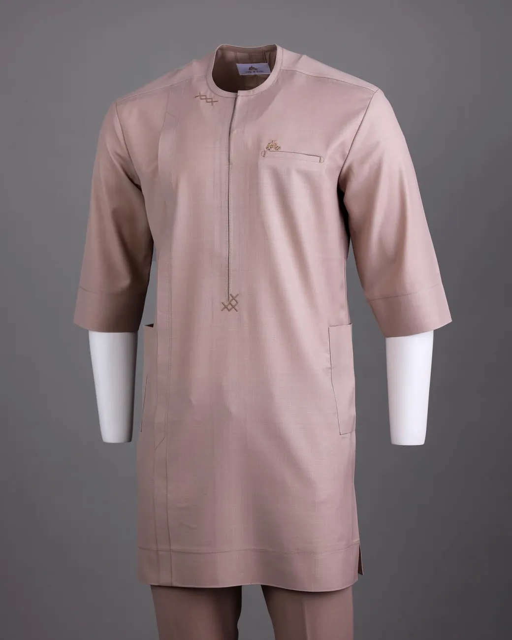 An Irish cream, zip line with dispersed arewa embroidery, 3/4 sleeve African senator Kaftan native.