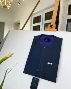 An Irish dark grey kaftan with clear view pearl matching Swarovski button