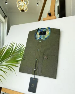 An Irish Green African kaftan with mixed shade of green paisley detailing