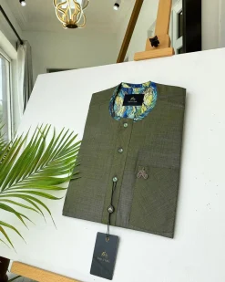 An Irish Green with a clear view of Swarovski stone buttons African kaftan and Sokoto