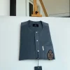 An Irish grey kaftan, button front flap, hand embroidery patch detailing, and a silver Swarovski African Kaftan and Sokoto