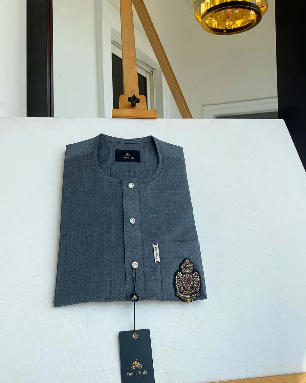 An Irish grey kaftan, button front flap, hand embroidery patch detailing, and a silver Swarovski African Kaftan and Sokoto