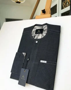 An Irish Grey Kaftan with a clear view of Swarovski button detailing