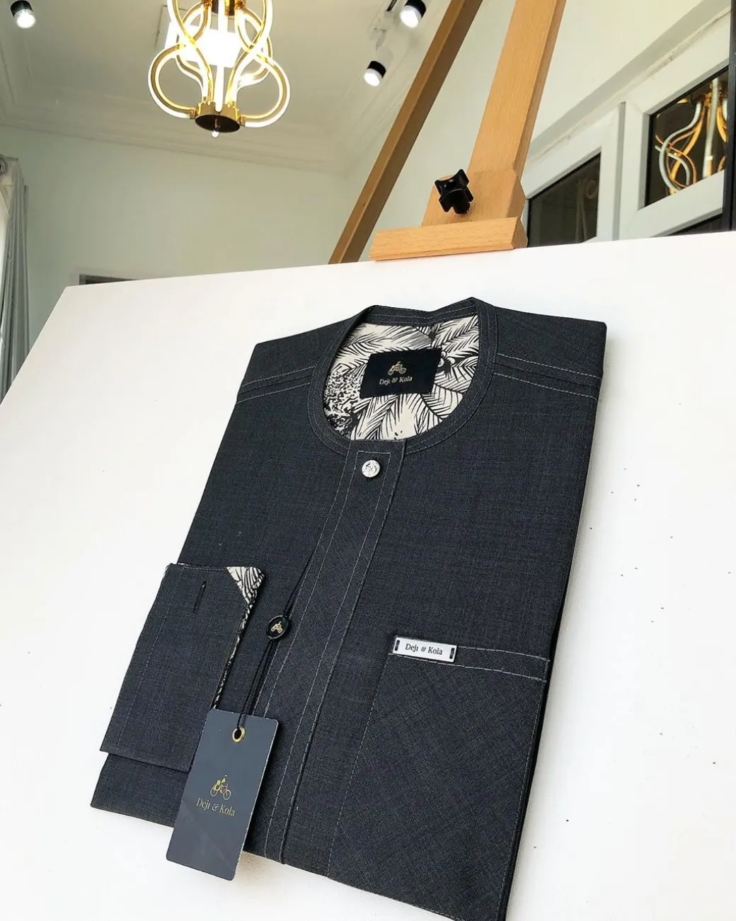 An Irish Grey Kaftan with a clear view of Swarovski button detailing