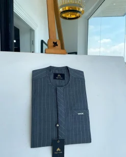 An iron-grey pencil stripe, front flap, and slant pocket detail Senator Kaftan native