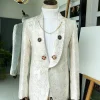 An Ivory Gold Patterned “From The Same Side” Shawl lapel Suit.
