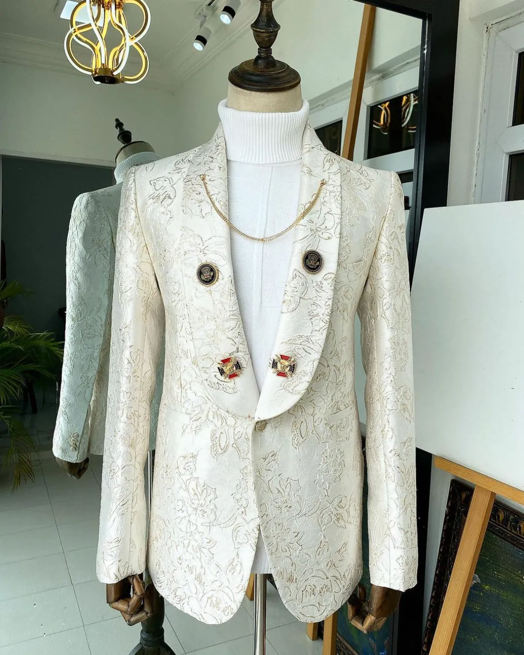 An Ivory Gold Patterned “From The Same Side” Shawl lapel Suit.