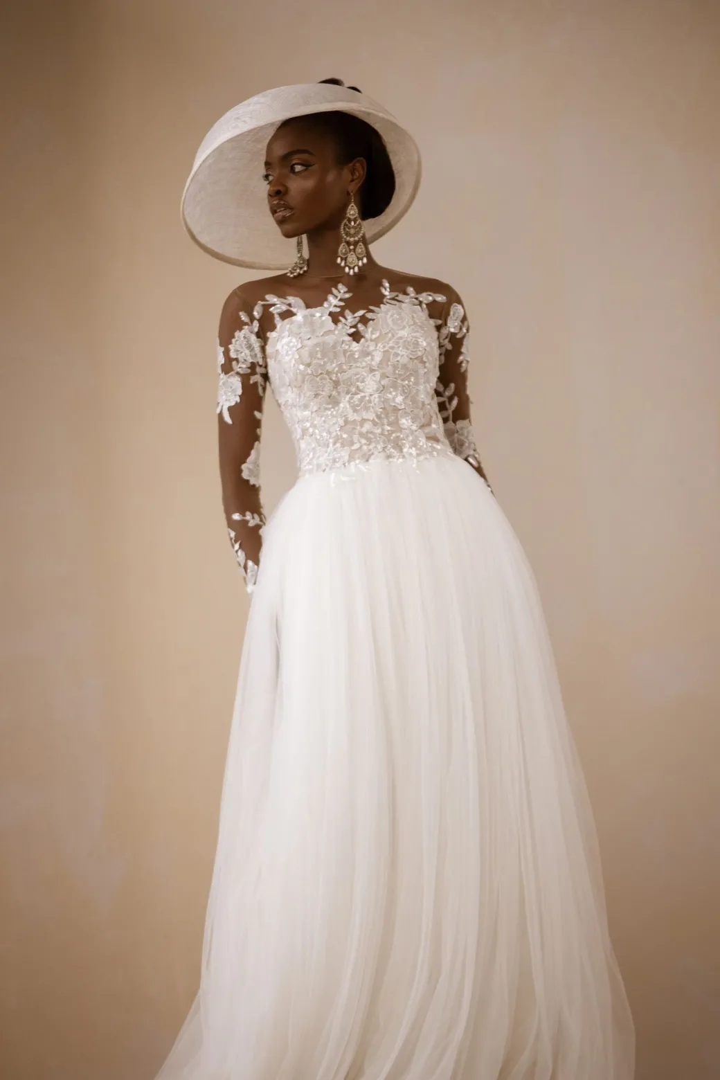 An Ivory Top Patterned Long Sleeve Tulle Wedding gown/dress
