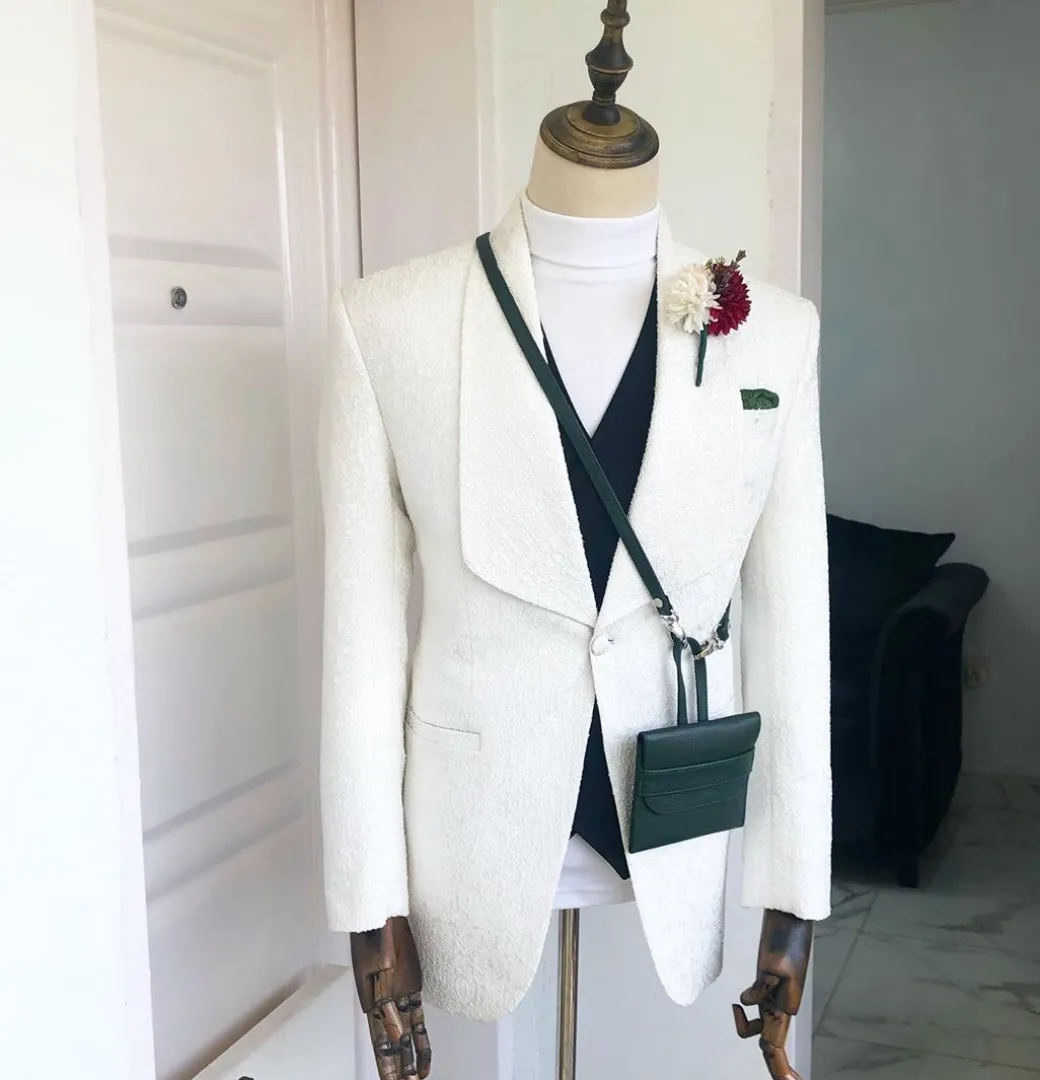 An Ivory White “Wedding In The Jungle” shawl lapel tuxedo suit
