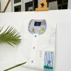 An Ivory white African kaftan, paisley detailing, Swarovski buttons