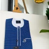 An ivory white and blue check, clear view transparent Swarovski buttons, front flap details African traditional senator kaftan native.