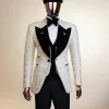 An Ivory white and Gold Floral patterned Peak lapel metallic jacquard tuxedo suit.