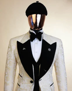An Ivory white and Gold Floral patterned Peak lapel metallic jacquard tuxedo suit.