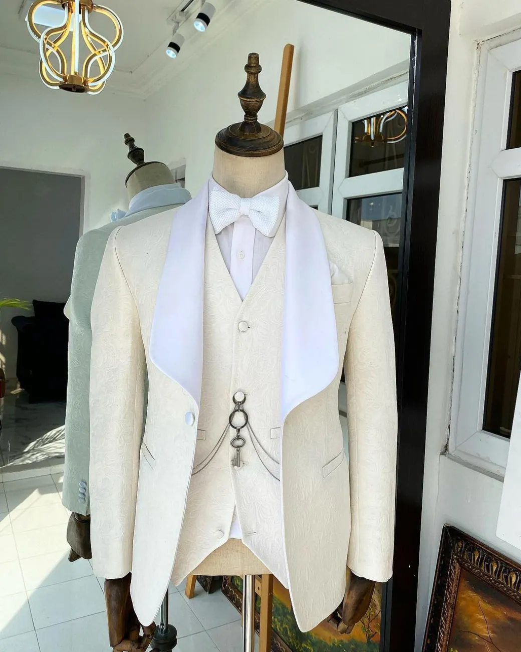 An Ivory White “Celestial” shawl lapel tuxedo tailored suit