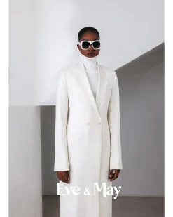 An Ivory White, Closed Notch Double-Breasted Suit