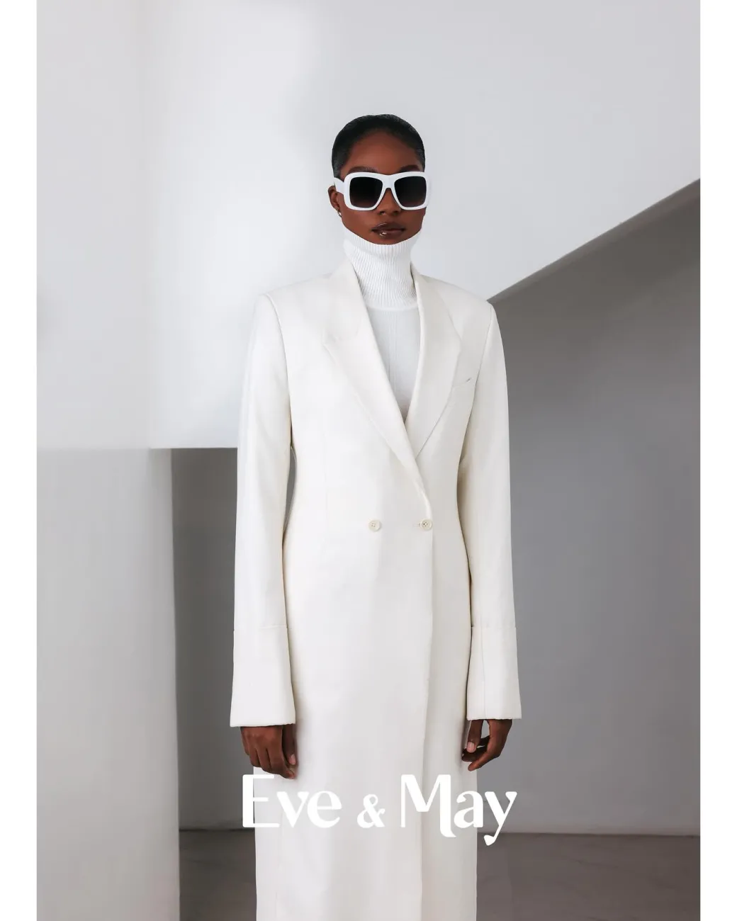 An Ivory White, Closed Notch Double-Breasted Suit