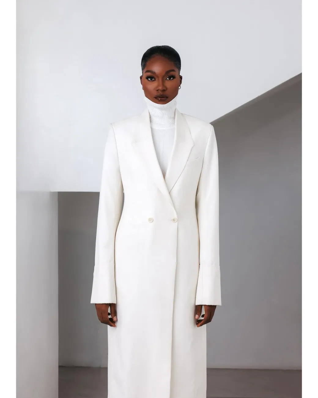 An Ivory White, Closed Notch Double-Breasted Suit