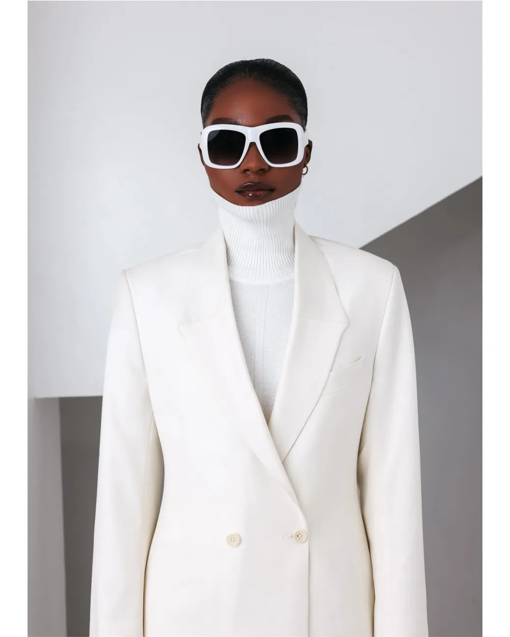 An Ivory White, Closed Notch Double-Breasted Suit