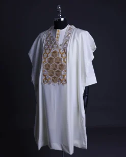 An Ivory White, Connected inverted cube -layered 3D embroidery design with splashed gold ss30 Swarovski stone details Agbada