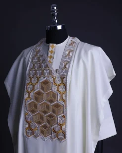 An Ivory White, Connected inverted cube -layered 3D embroidery design with splashed gold ss30 Swarovski stone details Agbada