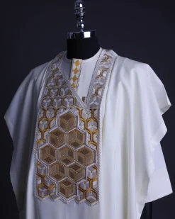 An Ivory White, Connected inverted cube -layered 3D embroidery design with splashed gold ss30 Swarovski stone details Agbada