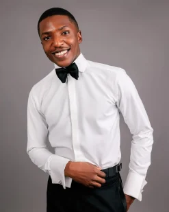 An Ivory white, covered button flap, tuxedo shirt.