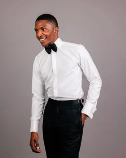 An Ivory white, covered button flap, tuxedo shirt.