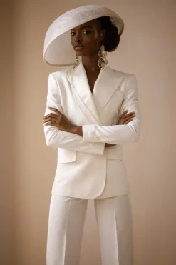An Ivory White Cross Tuxedo Bridal Suit