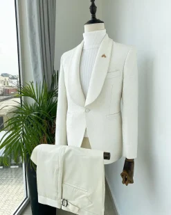 An Ivory White dispersed unequal pattern shawl lapel jacquard texedo suit.