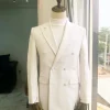 An Ivory White Double Breasted Peak Lapel Suit