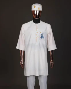 An Ivory white, dropping stars and bender knees metallic wire embroidery details agbada