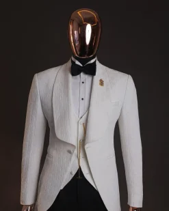 An Ivory white, elastic, basket weave layered floral jacquard shawl lapel tuxedo suit.
