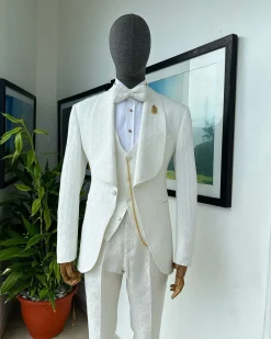 An ivory white, elastic, basket weave layered floral jacquard shawl lapel tuxedo suit.