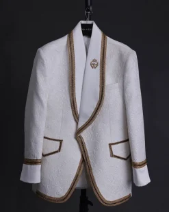 An ivory white floral Jacquard, gold trimmings, patch pocket shawl lapel tuxedo suit