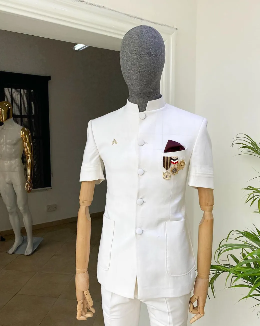 An Ivory White “French” Safari Suit.