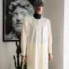 An Ivory white front flap with silver Swarovski button details, long-sleeve African senator kaftan native