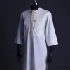 An Ivory White, front flap, patch pocket with gold embroidery detailing African senator kaftan native.