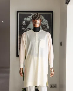 An Ivory white front flap with silver Swarovski button details, long-sleeve African senator kaftan native