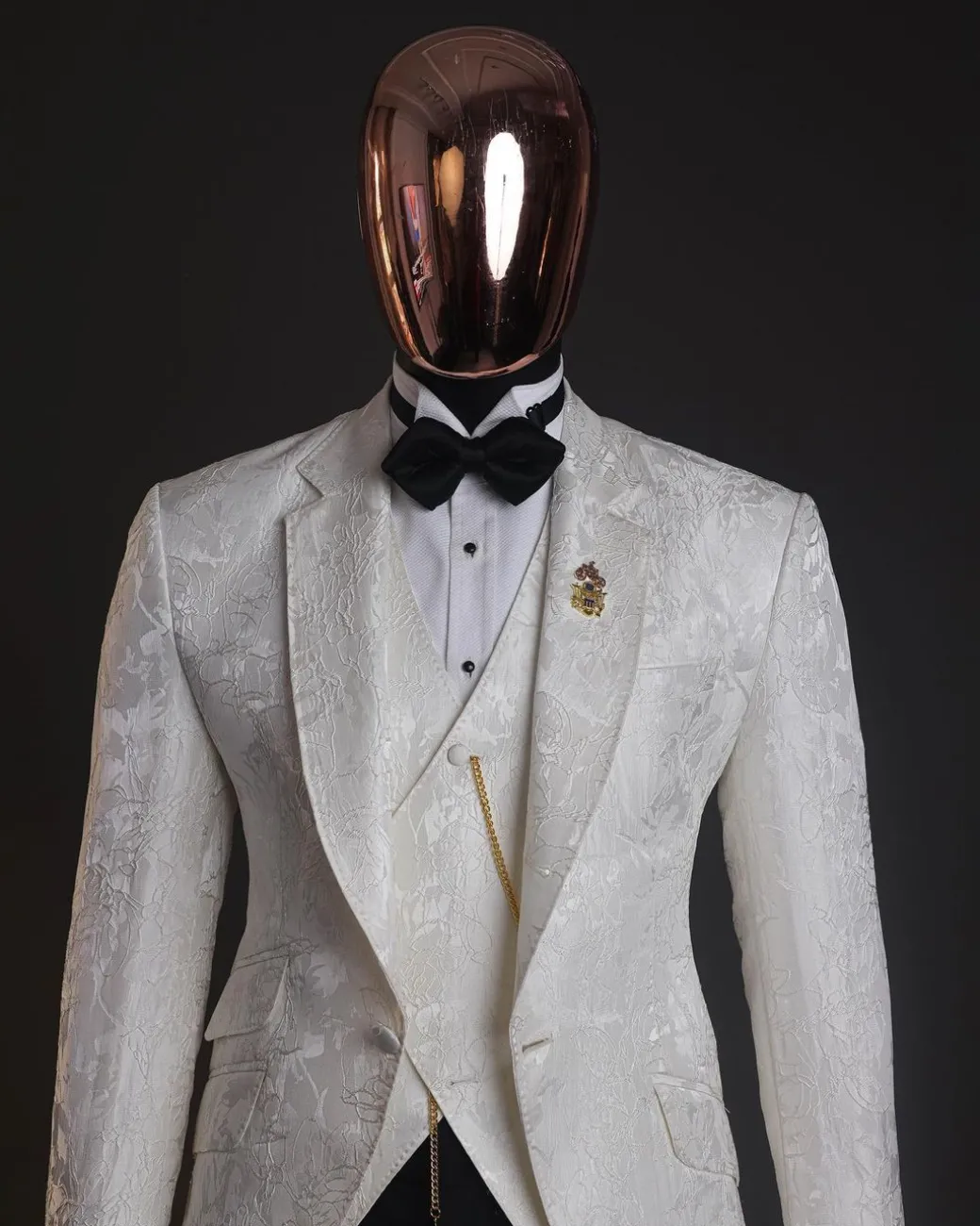An ivory white, knitted, root floral jacquard notch tuxedo lapel suit