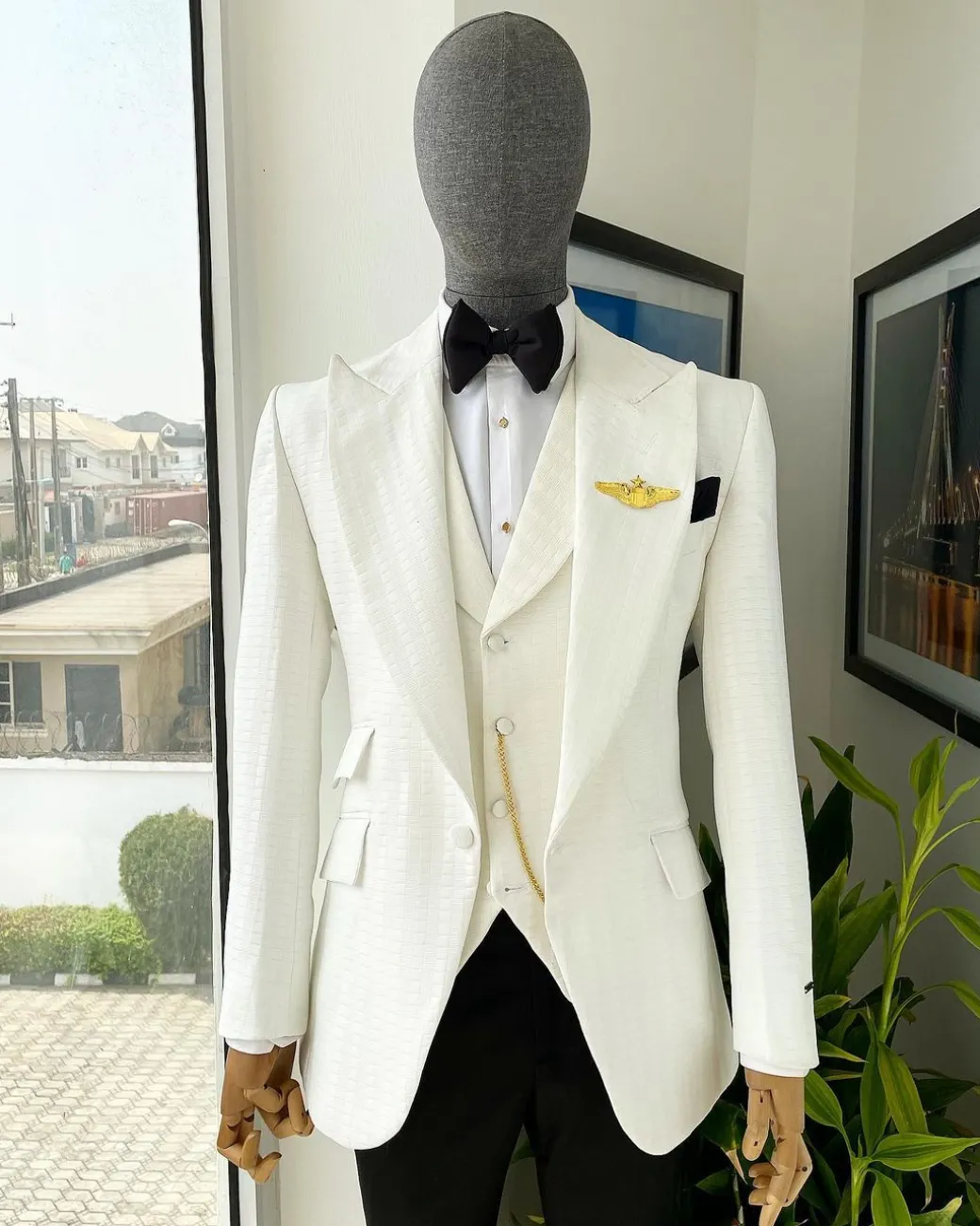 An Ivory White, Peak Lapel, Infinity Line And Square Patterned Jacquard Suit