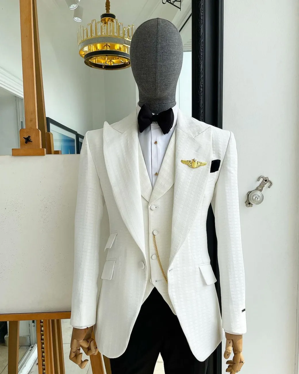 An Ivory White, Peak Lapel, Infinity Line And Square Patterned Jacquard Suit