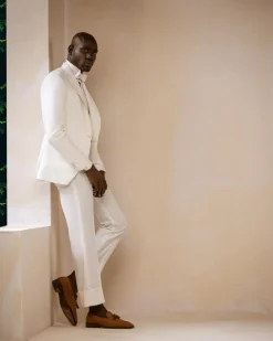 An Ivory White Shawl and peak lapel Tuxedo suit