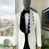 An Ivory white shawl lapel floral jacquard, satin taped lapel with floral details suit