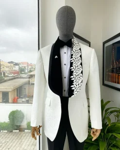 An Ivory white shawl lapel floral jacquard, satin taped lapel with floral details suit