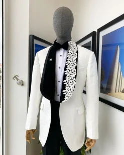 An Ivory white shawl lapel floral jacquard, satin taped lapel with floral details suit