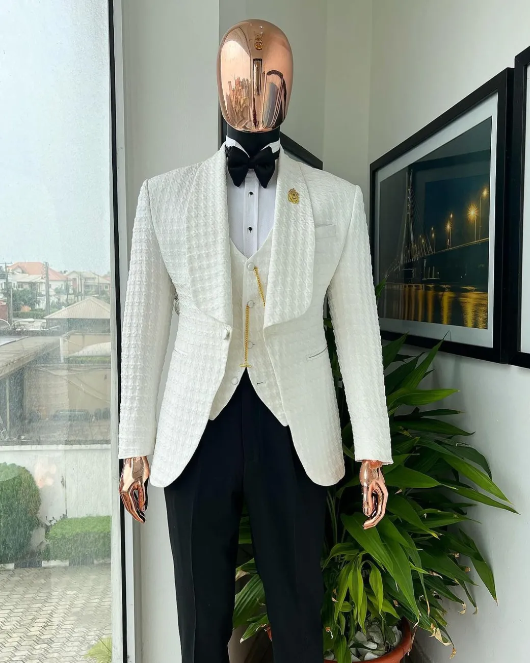 An Ivory white, swollen floral jacquard shawl lapel tuxedo suit