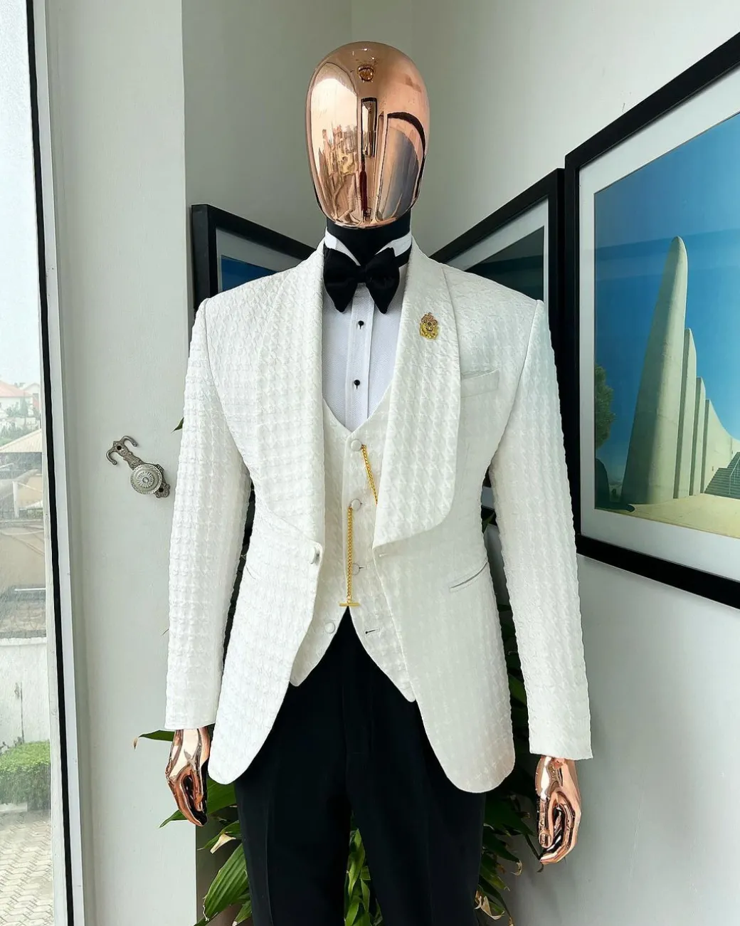 An Ivory white, swollen floral jacquard shawl lapel tuxedo suit