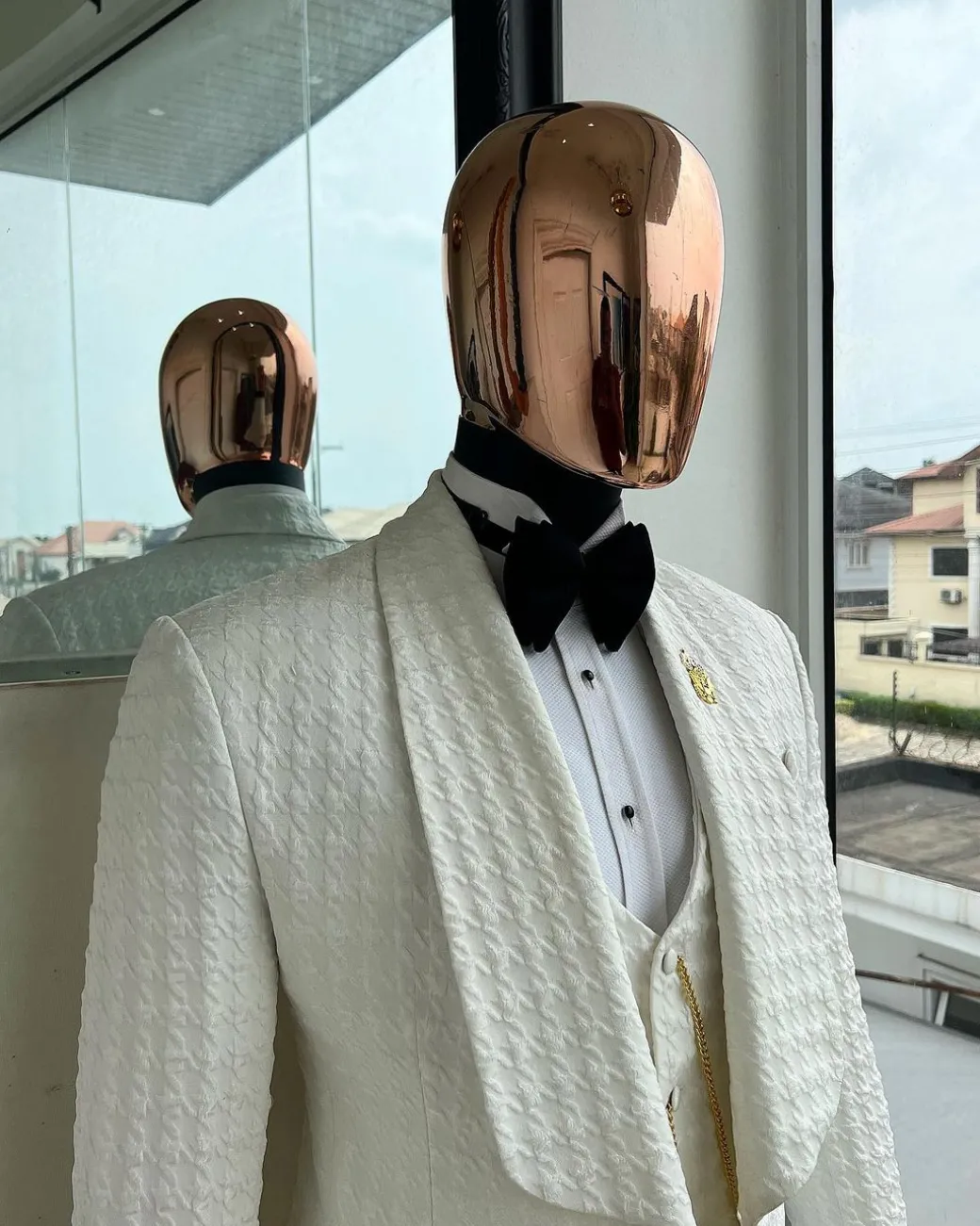 An Ivory white, swollen floral jacquard shawl lapel tuxedo suit