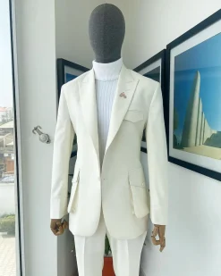 An Ivory white, x-large combat patch pocket, peak lapel suit