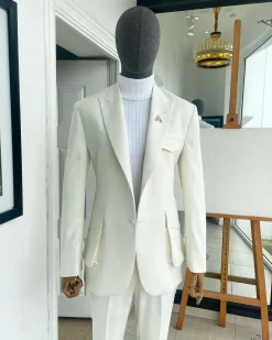 An Ivory white, x-large combat patch pocket, peak lapel suit